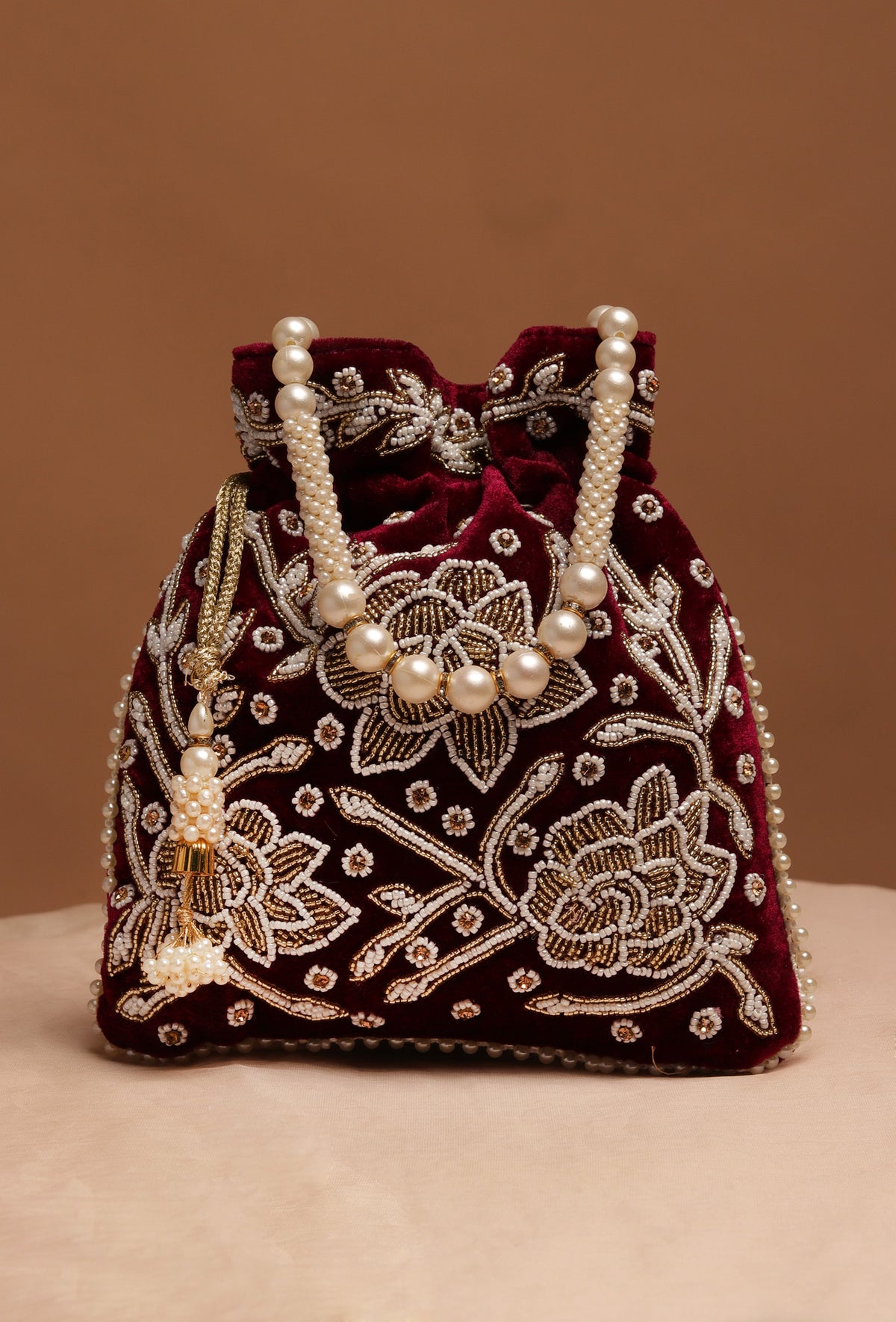 Elegant Boysenberry Bliss Potli With White Mogra Pearl